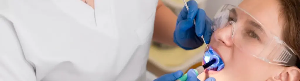 dentist-checking-patient-mouth-care