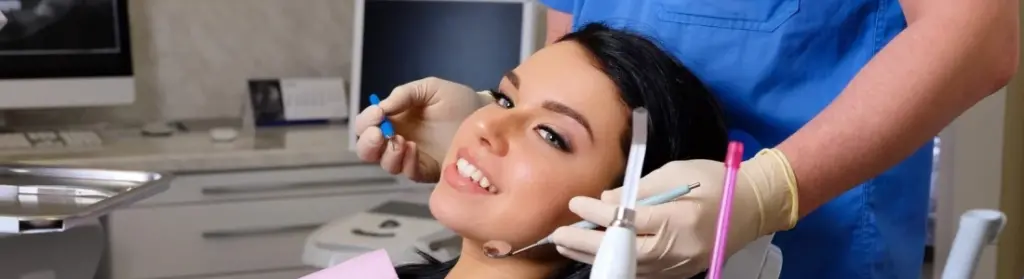 dentist-curing-female-patient-dentist-office-dentistry-care-woman-visit